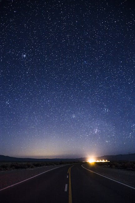 A scenic road leading into a starry night sky in San Juan, Argentina.